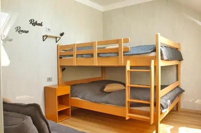 a bunk bed room with two bunk beds at Relax Apartma in Gornja Radgona