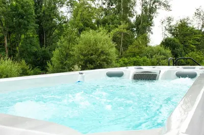 a jacuzzi tub in the back at Relax Apartma in Gornja Radgona