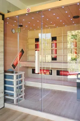 a display case in a store with wine bottles at Relax Apartma in Gornja Radgona