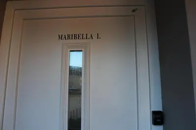 a sign on the door of a building at Maribella Apartment in Maribor