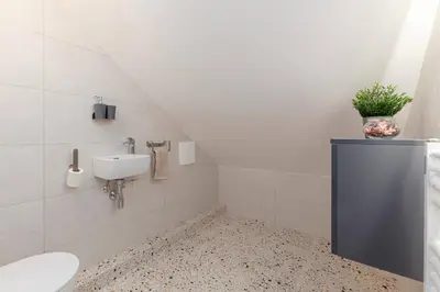 a bathroom with a sink and a toilet at Brlog 2 in Zgornje Gorje