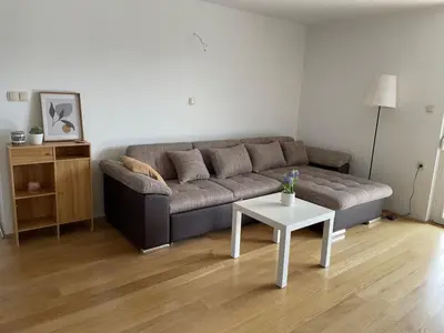a living room with a couch and a table at Apartment9B in Krško