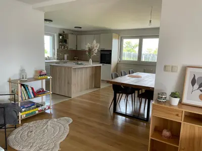 a kitchen with a table and a dining room at Apartment9B in Krško