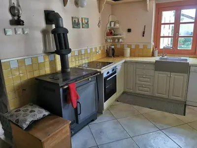 a kitchen with a stove and a sink in it at Domus Carstica in Sežana