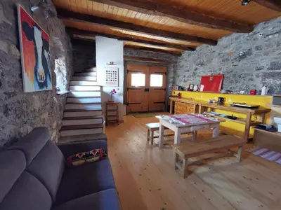 a living room with a couch and a table at Domus Carstica in Sežana