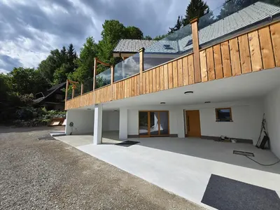 a house with a deck on top of it at Savinjski raj in Mozirje