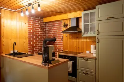 a kitchen with a counter with a coffee maker on it at Koča na Lazu in Ajdovščina