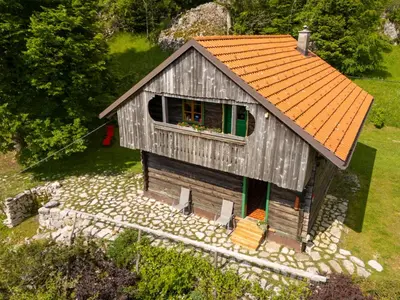 an overhead view of a small house with an orange roof at Koča na Lazu in Ajdovščina