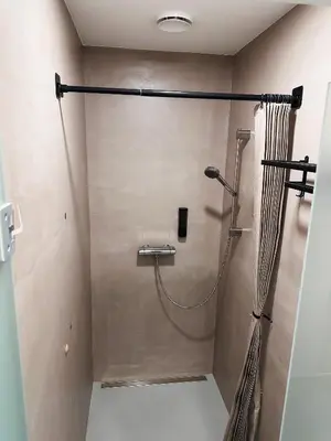 a shower in a bathroom with a shower curtain at Central Hostel Lesce-Bled in Lesce
