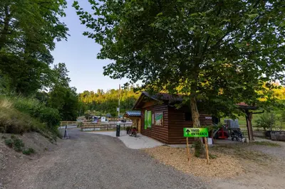a small cabin with a sign in front of it at Barbana Lipizzans Camper Park - Pitches for Campers and Tents in Radovljica