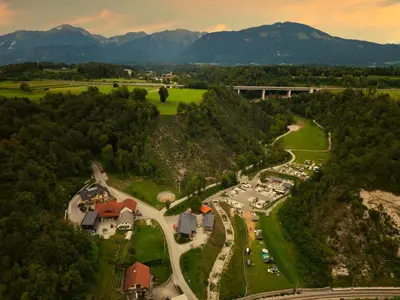 an aerial view of a park with mountains in the background at Barbana Lipizzans Camper Park - Pitches for Campers and Tents in Radovljica