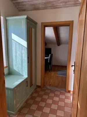 a room with a large aquarium next to a door at Omnia rooms in Sežana