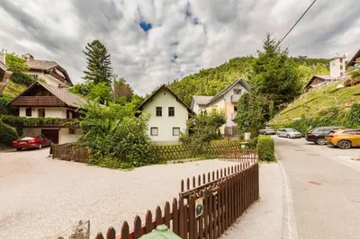 a wooden fence in front of a house at Happy Brook Bled in Bled