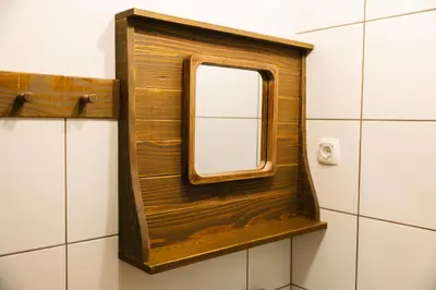 a mirror on a shelf in a bathroom at Homestead Lukec Studio Apartments - Archery, BBQ, Escape Room, Kayaking in Kostel