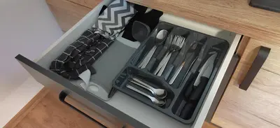 a tool box with utensils in it on a counter at MaxLux Apartments in Slovenj Gradec