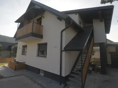 a house with a staircase and a balcony at MaxLux Apartments in Slovenj Gradec