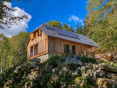 a wooden house on top of a pile of rocks at Villa Taja