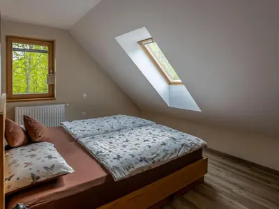 a bedroom with two beds and a window at Villa Taja
