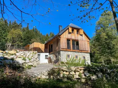a home with a wooden house on top of it at Villa Taja