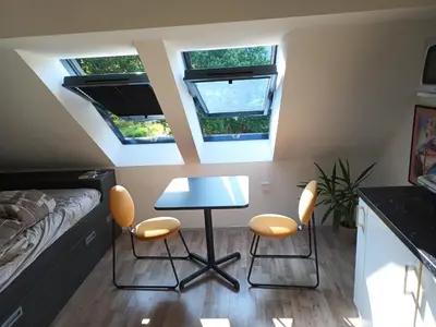 a small room with a table and two chairs at Apartment Simon in Škofja Loka