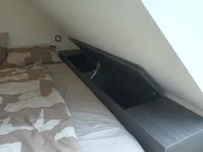 a bedroom with a bed in a attic at Apartment Simon in Škofja Loka