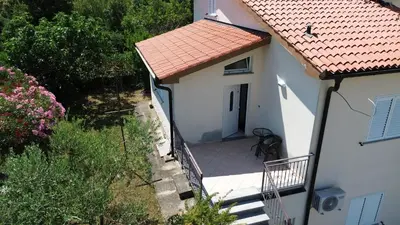 an overhead view of a white house with a porch at Apartma DaPDa in Spodnje Škofije