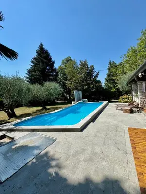 a swimming pool in the backyard of a house at Božič Residence in Vipava