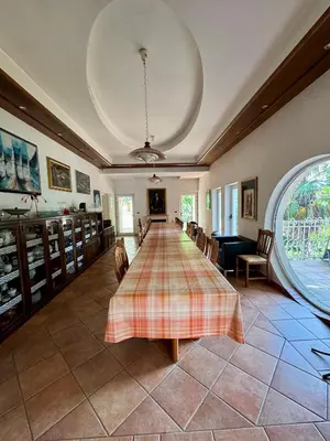 a large room with a long table and chairs at Božič Residence in Vipava