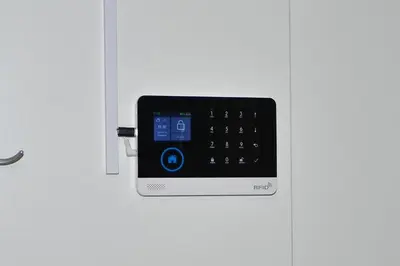 a cell phone is attached to a door at Emina Hiška in Braslovče