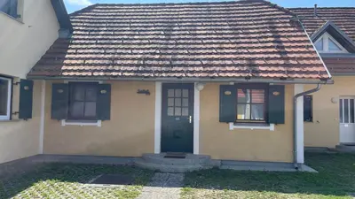a small house with a green door and windows at Terme Čatež apartma Solist