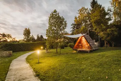 a yurt in a field next to a path at Glamping Bizjak in Preddvor