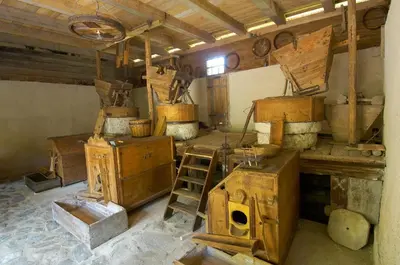 a room with lots of wooden boxes and a ladder at Turistična kmetija Povh in Prevalje
