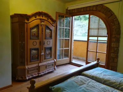 a bedroom with a bed and a large window at Vila Gradisca in Gradišča