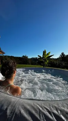 a woman in a jacuzzi in a pool at Vila Gradisca in Gradišča