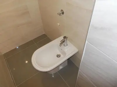 a bathroom with a sink and a toilet at Apartma Prima in Podbočje