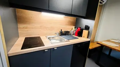 a small kitchen with a sink and a counter at Relax Tiny House Ljubljana in Ljubljana