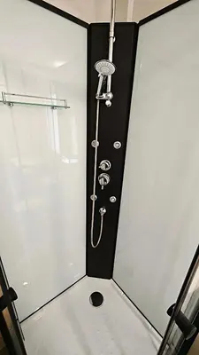 a shower in a room with a shower head at Relax Tiny House Ljubljana in Ljubljana
