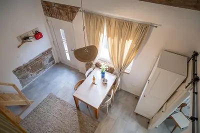 an overhead view of a room with a table and a window at Garage Apartments in Nova Gorica