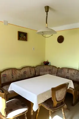 a table and a couch in a living room at Bohinj Countryside House in Bohinjska Bistrica