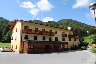 a large building with balconies on the side of it at Pri Vidrgarju in Vače