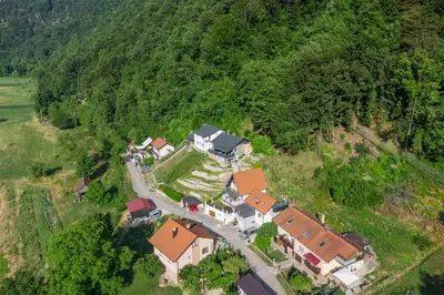 an aerial view of a house on a hill at Apartma Manca in Jesenice na Dolenjskem