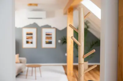 a wooden staircase in a living room at Apartment Berc in Bled
