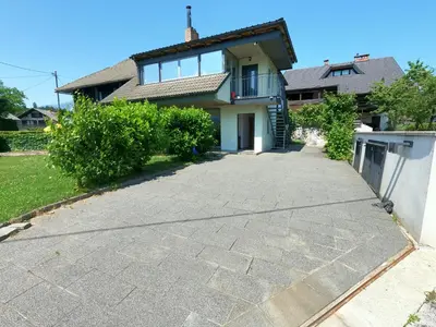 a driveway in front of a house at GM apartma in Radovljica