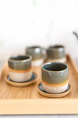 a group of three cups sitting on a wooden tray at Chalet Bohinj Bliss Wellness and view of Triglav in Bohinj