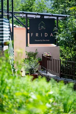 a sign for the fida house by the river at Apartma FRIDA in Most na Soči