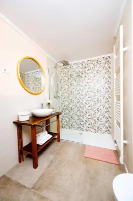 a bathroom with a sink and a mirror at Apartma FRIDA in Most na Soči