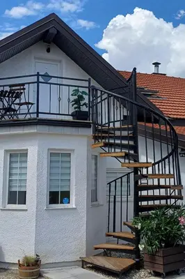 a house with a staircase on the side of it at Studio apartma ZARA in Slivnica pri Mariboru