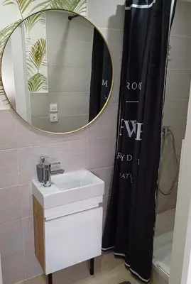 a bathroom with a sink and a mirror at Studio apartma ZARA in Slivnica pri Mariboru