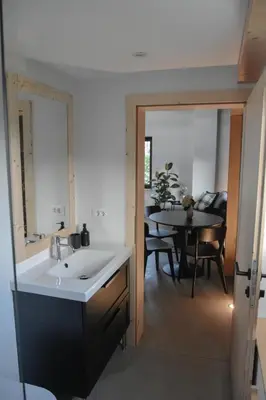 a kitchen and dining room with a sink and a table at Viktor Estate in Deskle