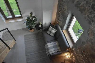 an overhead view of a living room with a couch and windows at Viktor Estate in Deskle